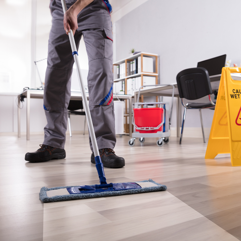 Janitor cleaning an office space